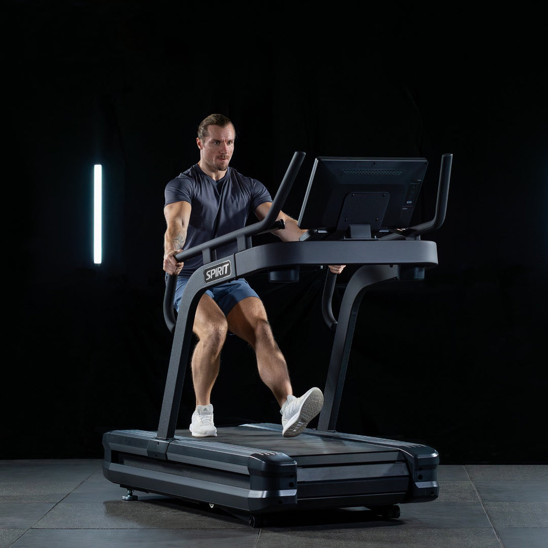 SPIRIT Fitness CTSBS900 commercial slat belt sled treadmill with curved handrails, LED console and vulcanized rubber slat running surface