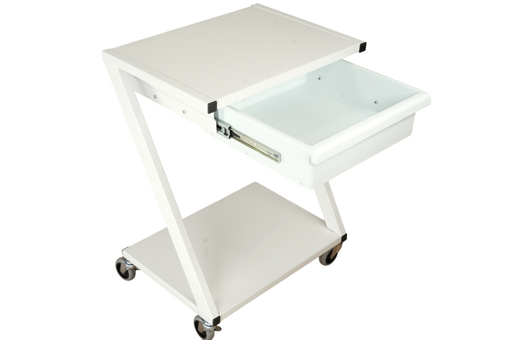 Mobile white powder-coated steel medical storage cart with integrated drawer and open shelving used for organizing therapy equipment and clinical supplies in a healthcare treatment room.